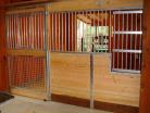 Medium shot of a Welded horse stall front with large feed door