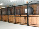 Medium shot of multiple nobleman stall fronts with v-doors