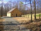 Wooden barn, wooden fence, in the woods