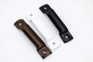a trio of brackets. one brown, one white and one black