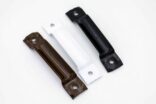 a trio of brackets. one brown, one white and one black