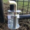 closeup of top of anchor installed on a gate
