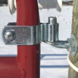 sideview close-up image of gate line attached to a red tube gate