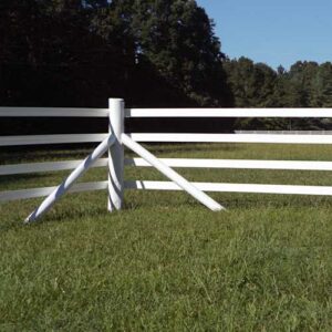a photo of the corner of a white 4 rail fence