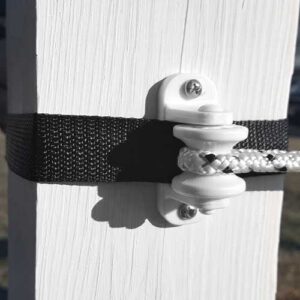 webbing and braided electric rope being held by an insulator