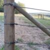 three assemblies on a wooden post