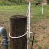 closeup of white end loop at the top of a brown post