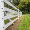 a 4 rail fence showing them attached to a post with end plates