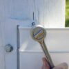 ratchet driving lag bolt into post for end plate