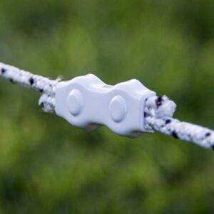 a strand of white and black braided electric fence joined with a white connector