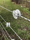 tightener strung with white and black braided electric rope