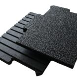 Interlocking horse stall mats with etched top surface