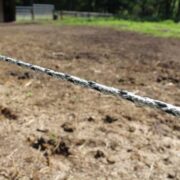 a single strand of white and black braided electric fencing