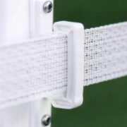 closeup of white tape connected to a white post with a white plastic connector