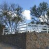PVC fence installed on a stone wall