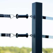 2 black electric gate handles connected to 2 rails of electric tape