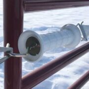 closeup of a white electric gate handle