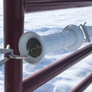 closeup of a white electric gate handle
