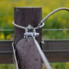 Tensioner holding fence tight