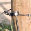 connector attached to wire on fence post