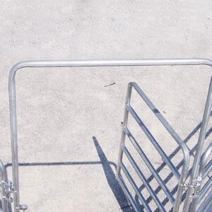 detail from above of open galvanized silver gate